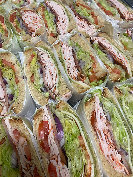 A table of sandwiches by AJ's